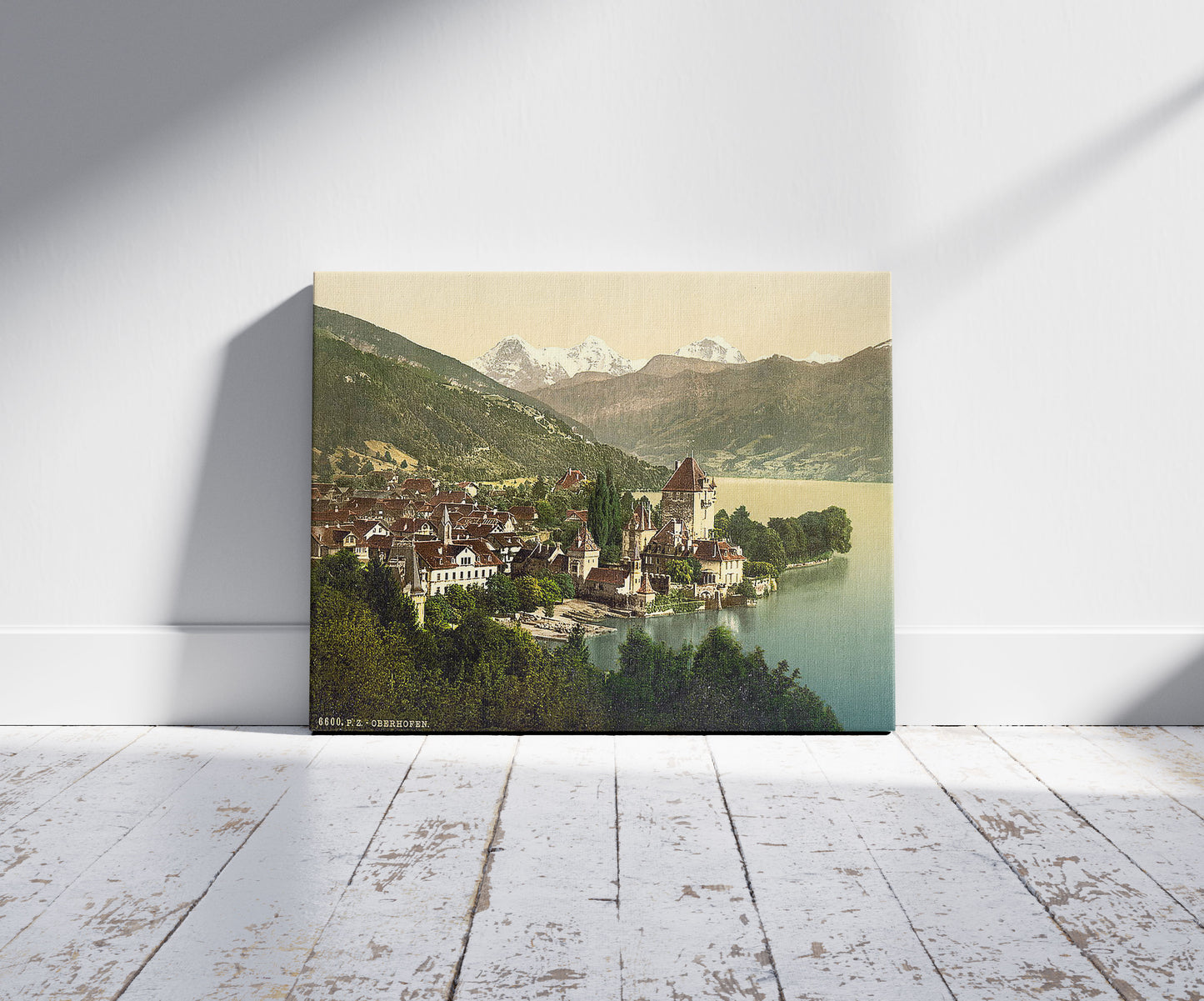 A picture of Thun, Oberhofen, Bernese Oberland, Switzerland, a mockup of the print leaning against a wall