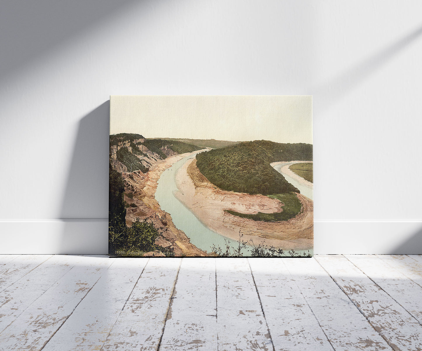 A picture of Tidenham bend and cliffs, Chepstow, Wales, a mockup of the print leaning against a wall