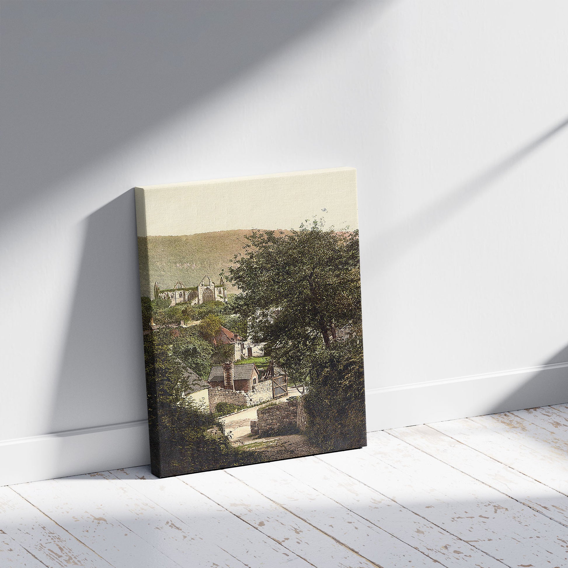 A picture of TIntern Abbey & village, a mockup of the print leaning against a wall