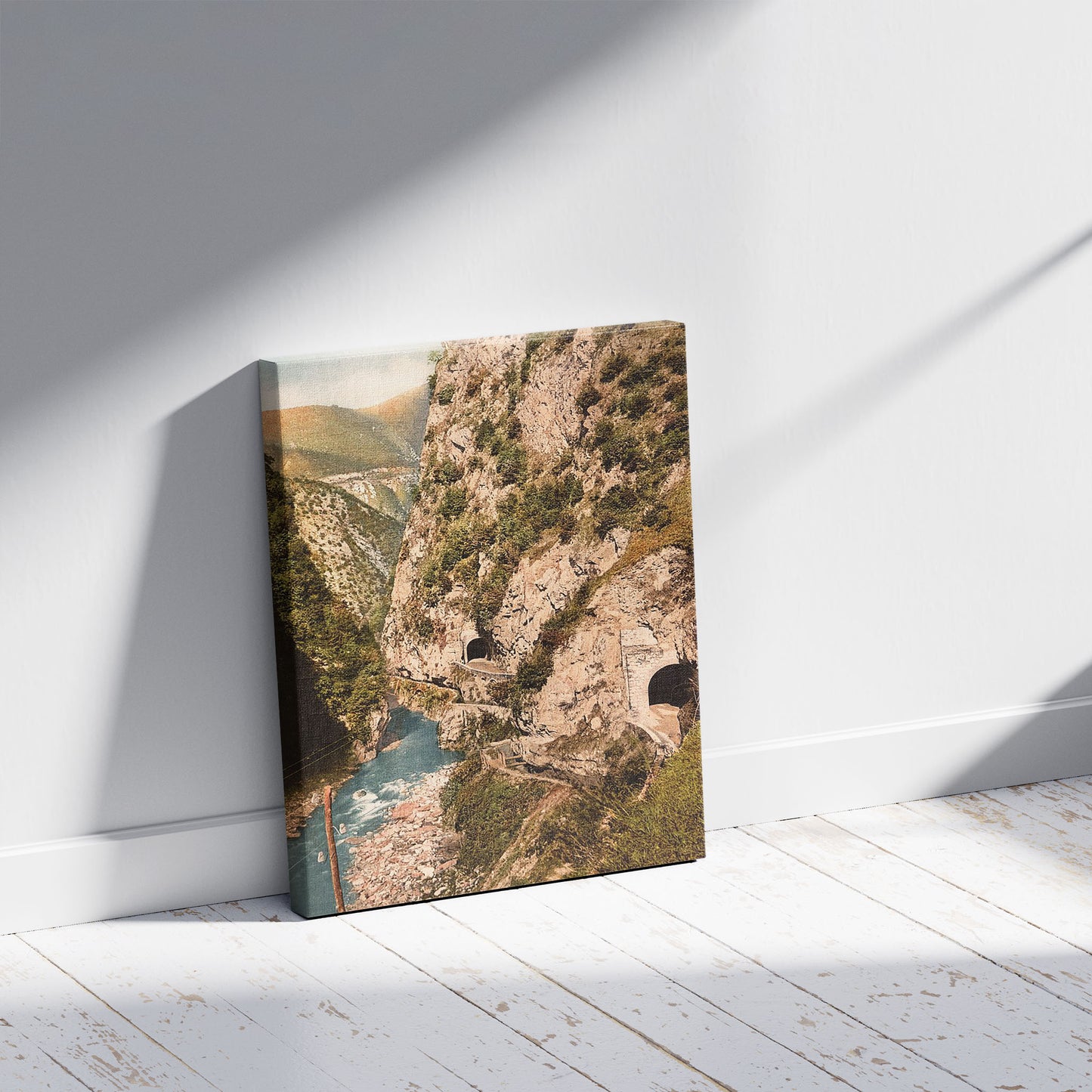 A picture of Toscolana (i.e. Toscolano) Valley, roads and tunnels, Lake Garda, Italy, a mockup of the print leaning against a wall