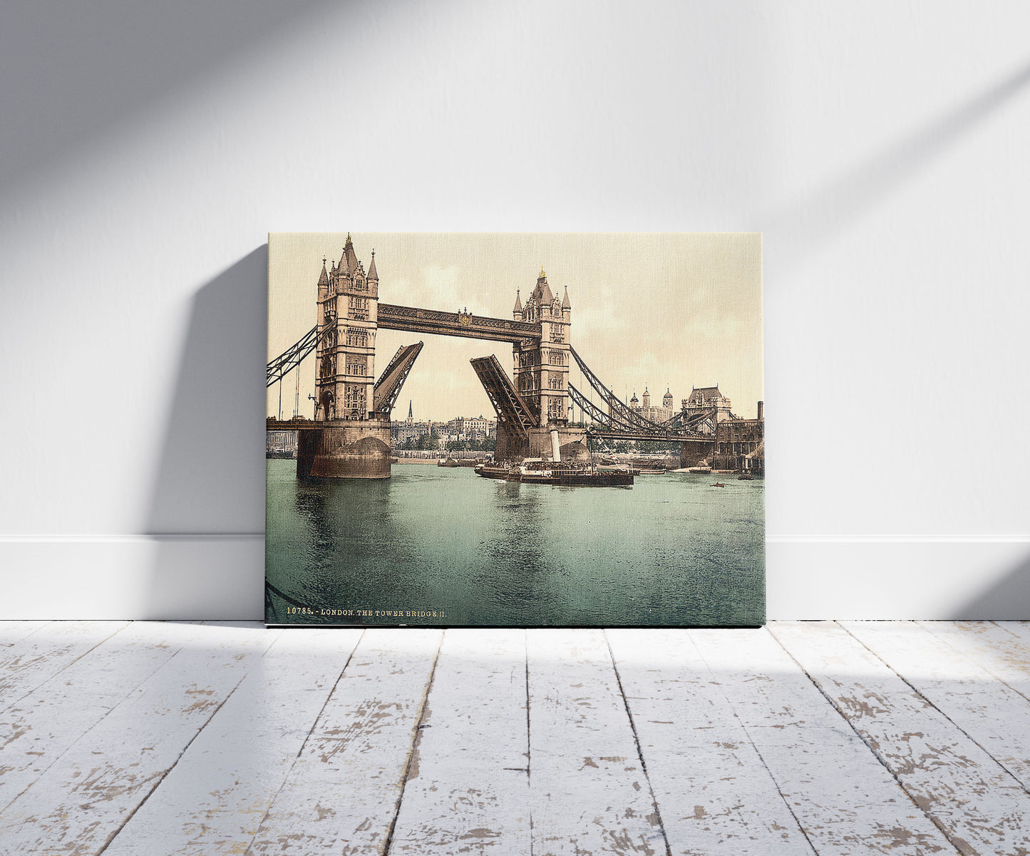 A picture of Tower Bridge, II. (open), London, England, a mockup of the print leaning against a wall