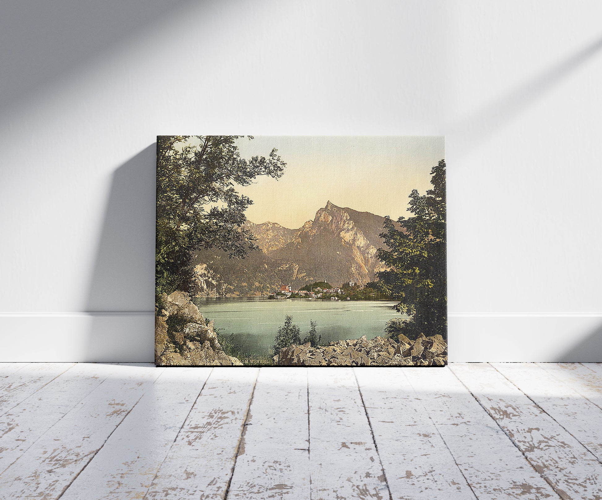 A picture of Traunkirchen, from Winkel, Upper Austria, Austro-Hungary, a mockup of the print leaning against a wall