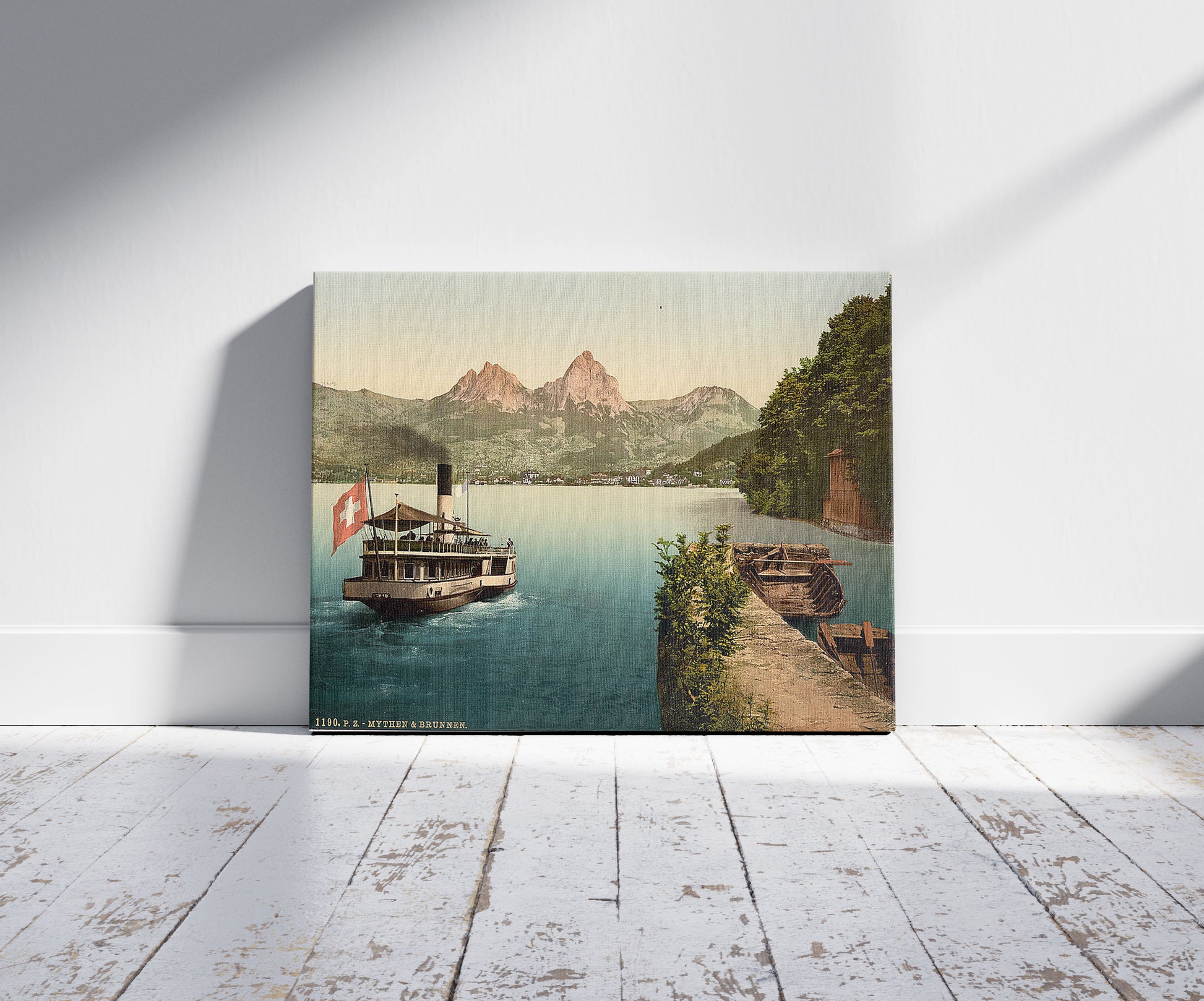 A picture of Treib and Mythen, Lake Lucerne, Switzerland, a mockup of the print leaning against a wall