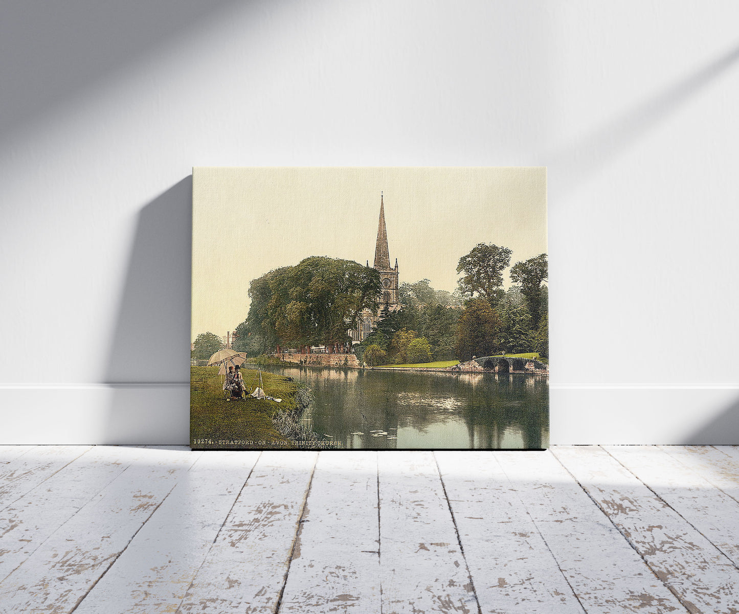 A picture of Trinity Church from the river, Stratford-on-Avon, England, a mockup of the print leaning against a wall