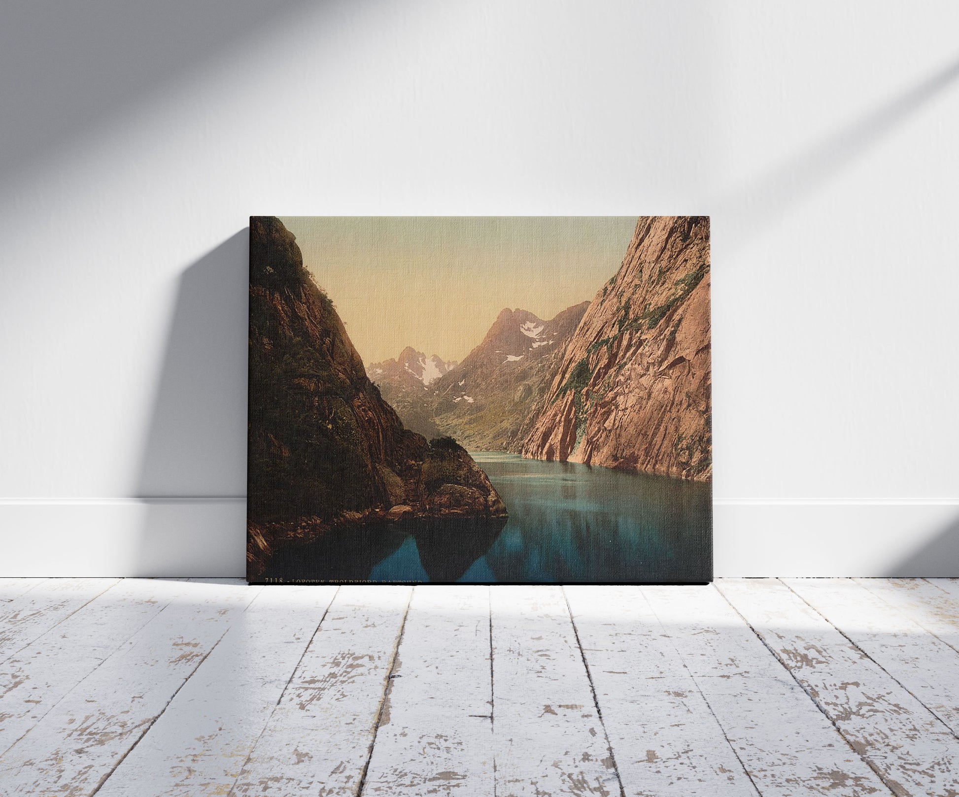 A picture of Troldfjord (i.e.,Trollfjord), Raftsund, Lofoten, Norway, a mockup of the print leaning against a wall