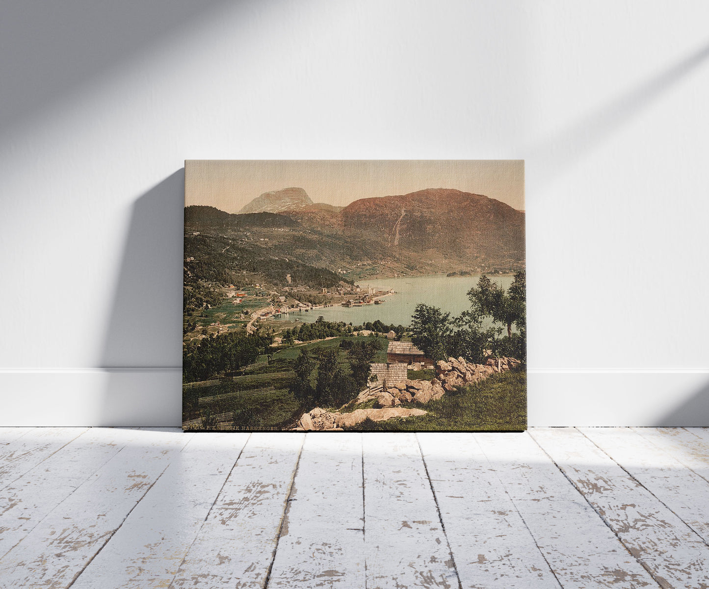 A picture of Ulvik Hardanger, Hardanger Fjord, Norway, a mockup of the print leaning against a wall