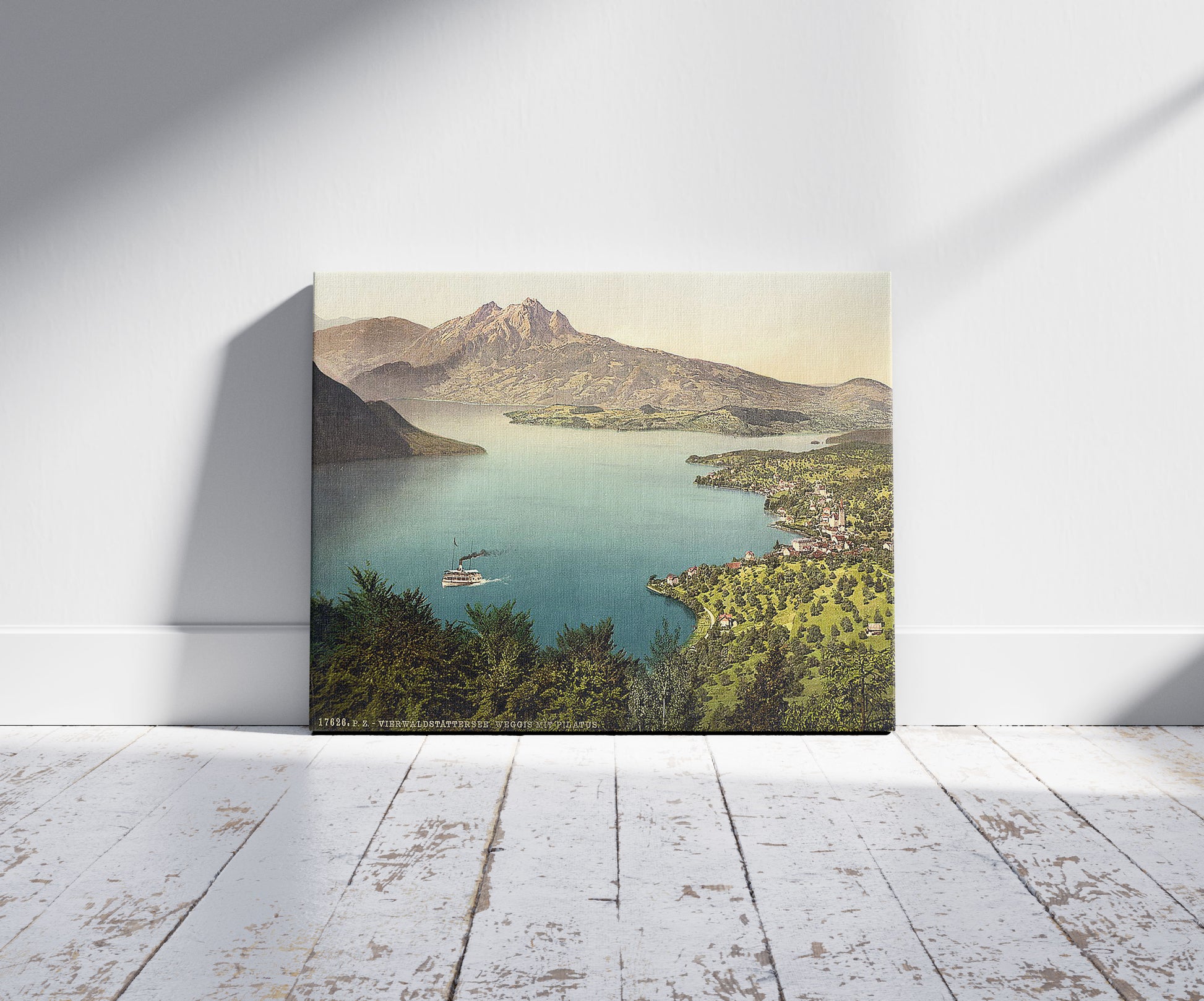 A picture of Urnersee and Pilatus, Lake Lucerne, Switzerland, a mockup of the print leaning against a wall
