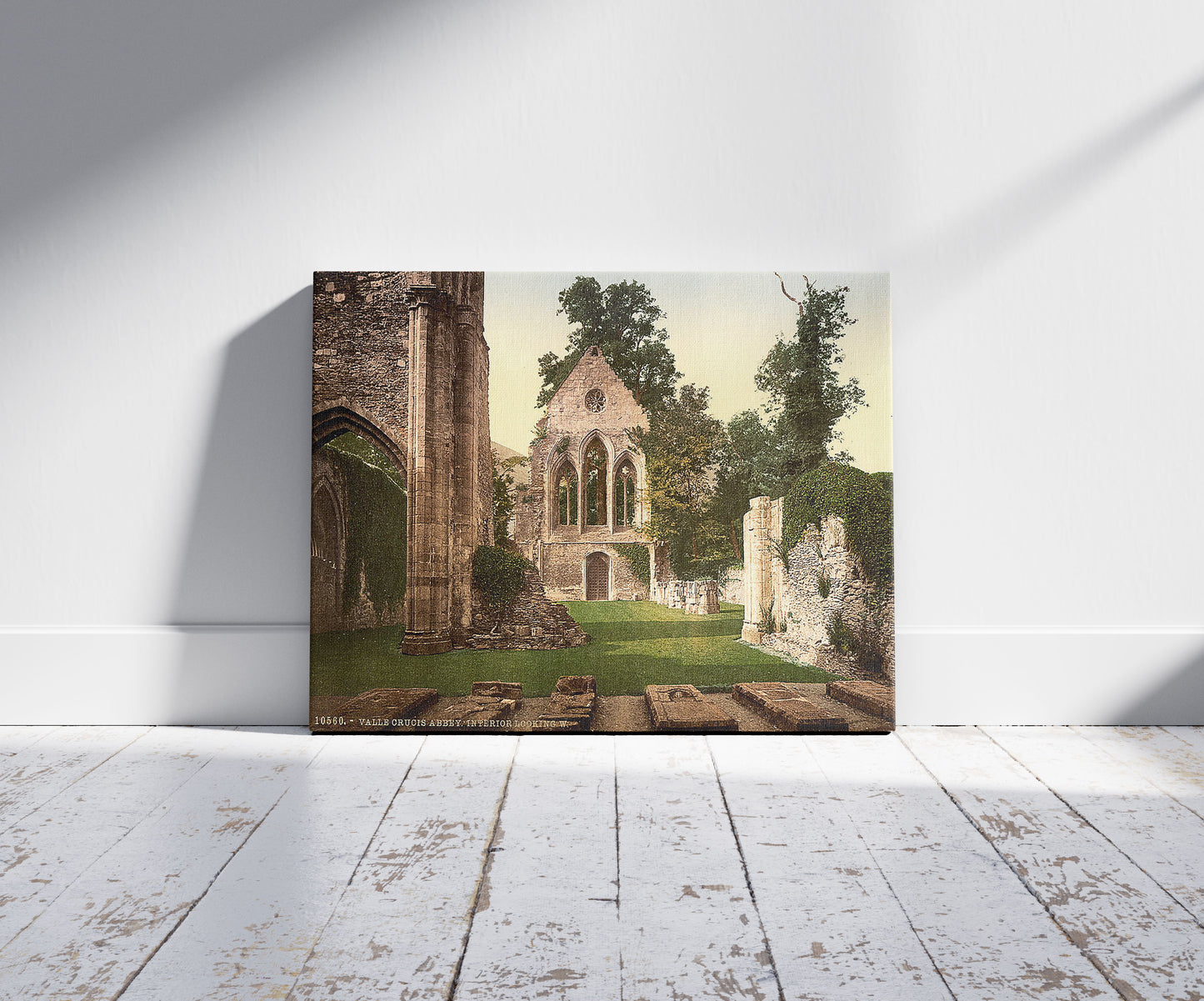 A picture of Valle Crucis Abbey, interior looking west, Llangollen, Wales, a mockup of the print leaning against a wall