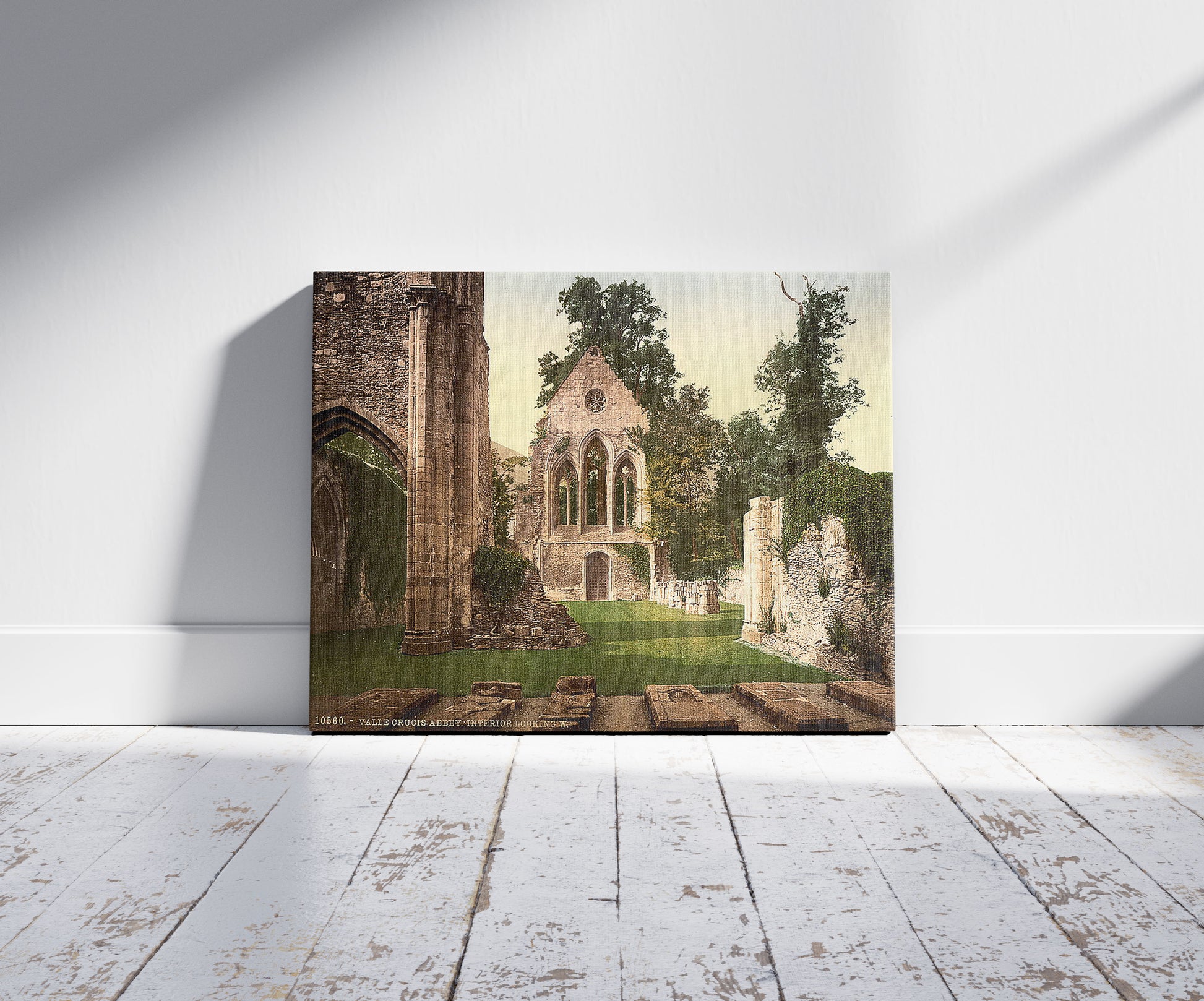 A picture of Valle Crucis Abbey, interior looking west, Llangollen, Wales, a mockup of the print leaning against a wall