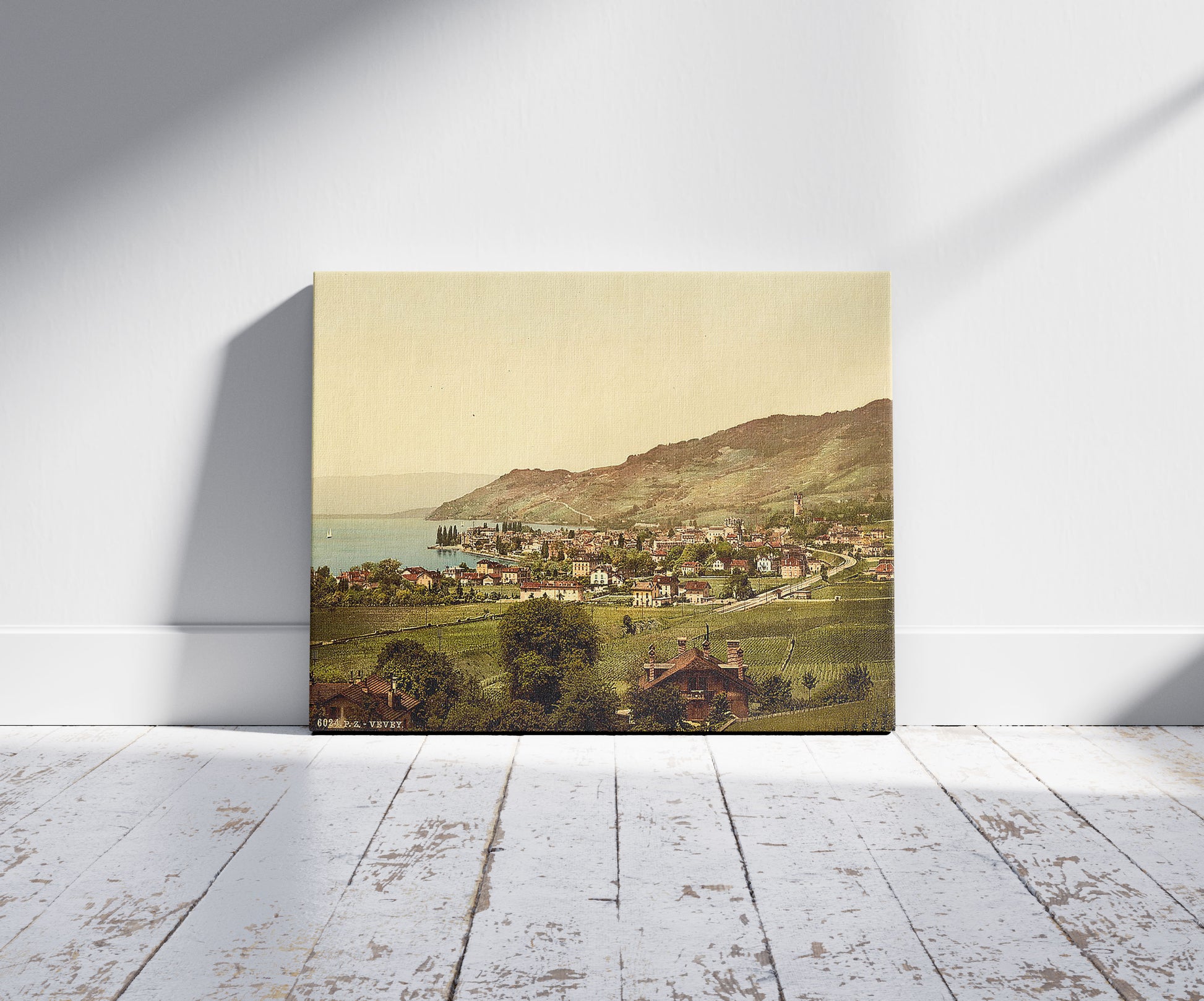 A picture of Vevey, general view, Geneva Lake, Switzerland, a mockup of the print leaning against a wall