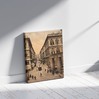 A picture of Via Roma, Genoa, Italy, a mockup of the print leaning against a wall