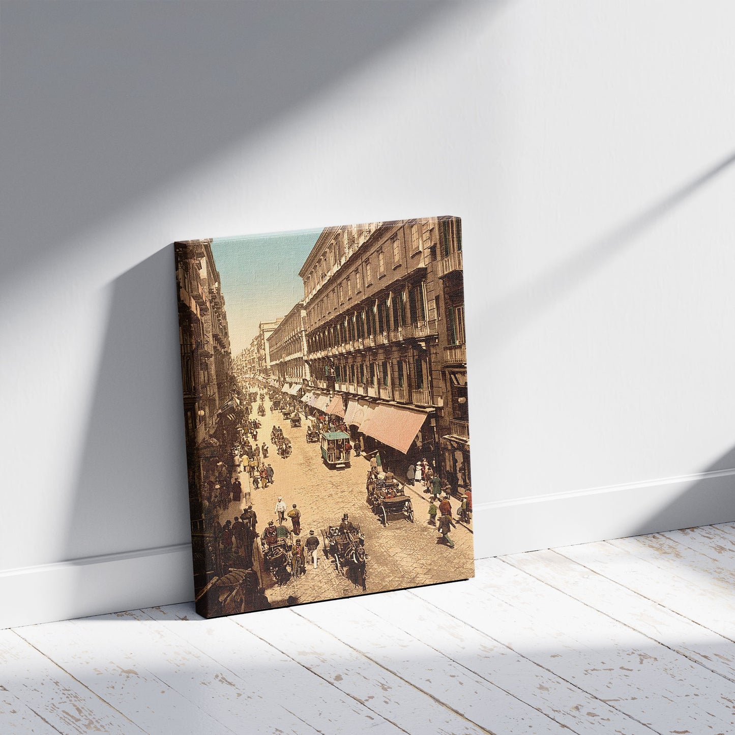 A picture of Via Roma, Naples, Italy, a mockup of the print leaning against a wall