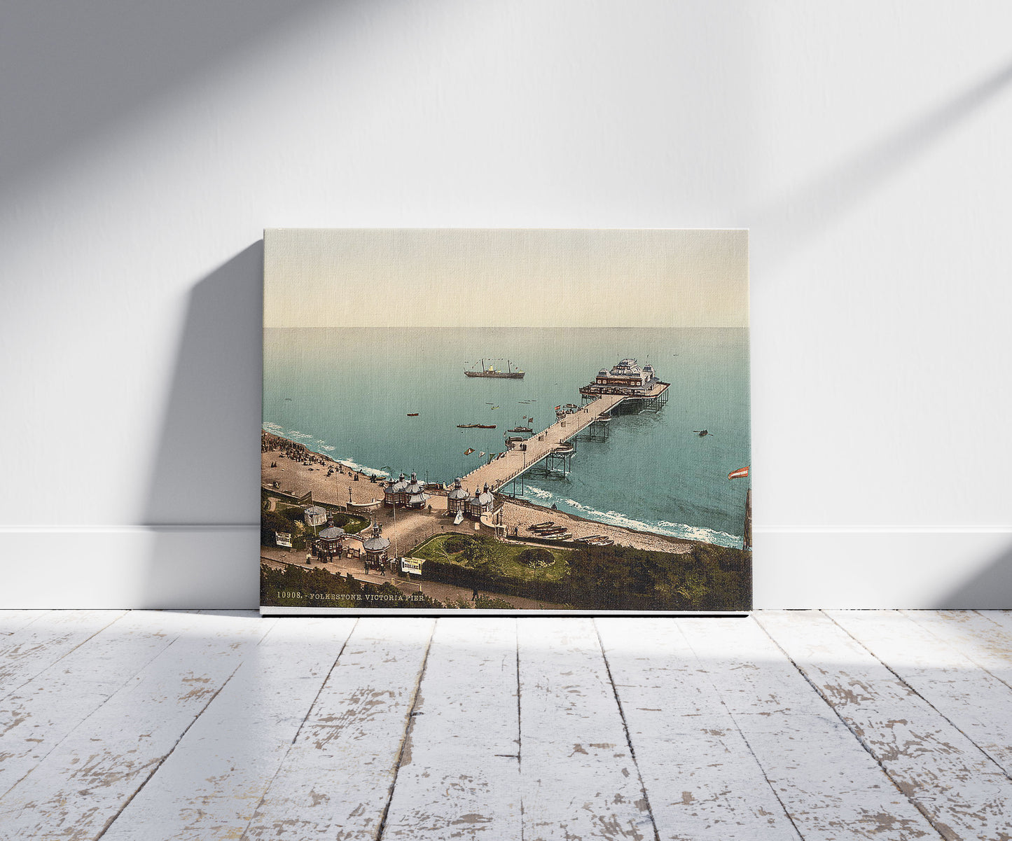 A picture of Victoria Pier, Folkestone, England, a mockup of the print leaning against a wall