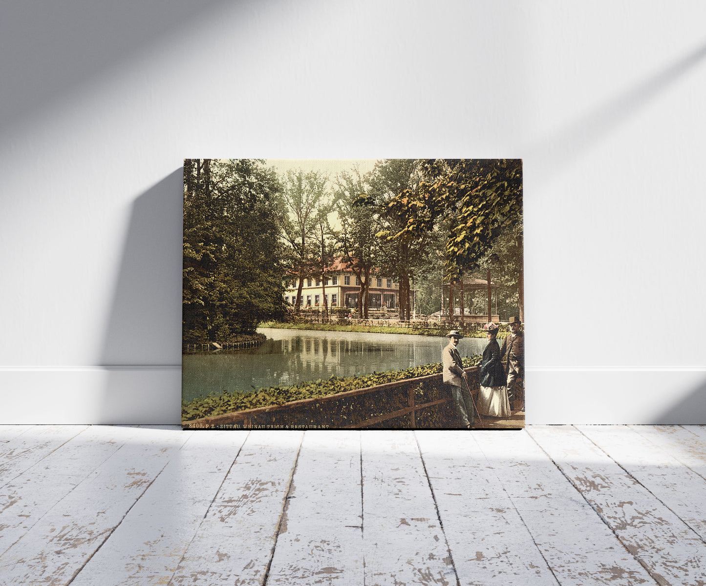 A picture of Weinau Pond and restaurant, Zittau, Saxony, Germany, a mockup of the print leaning against a wall