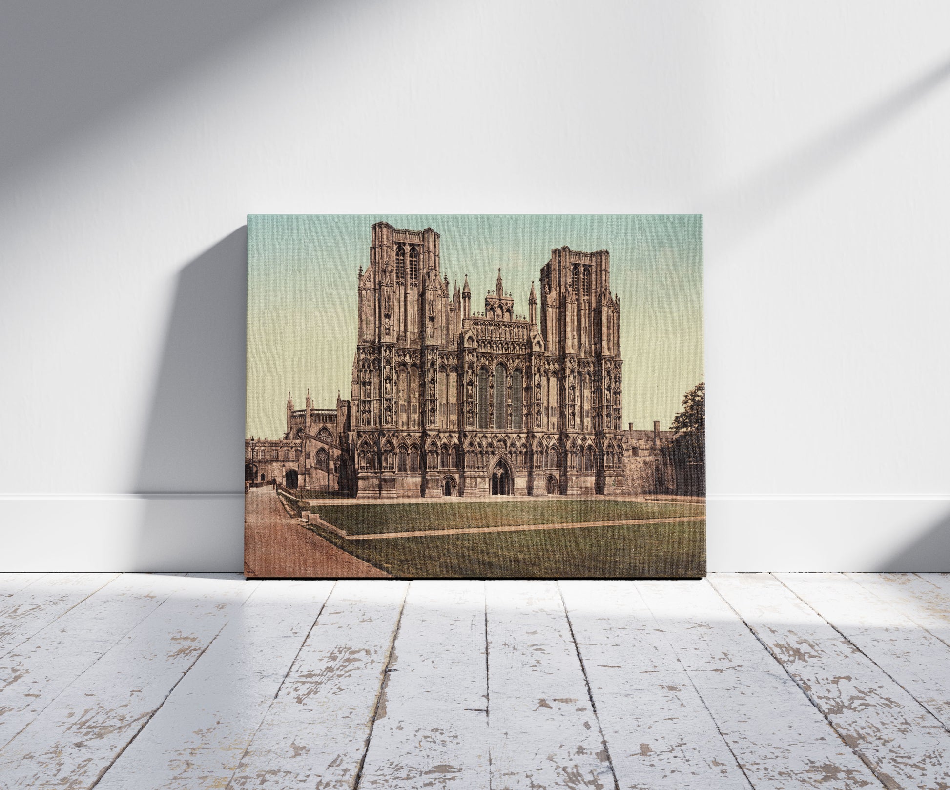 A picture of Wells Cathedral. Westfront, a mockup of the print leaning against a wall