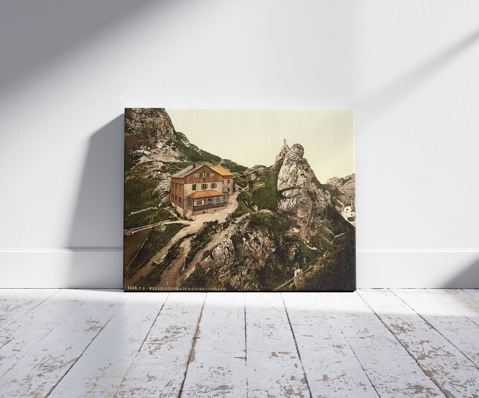 A picture of Wendel stone house, Upper Bavaria, Germany, a mockup of the print leaning against a wall