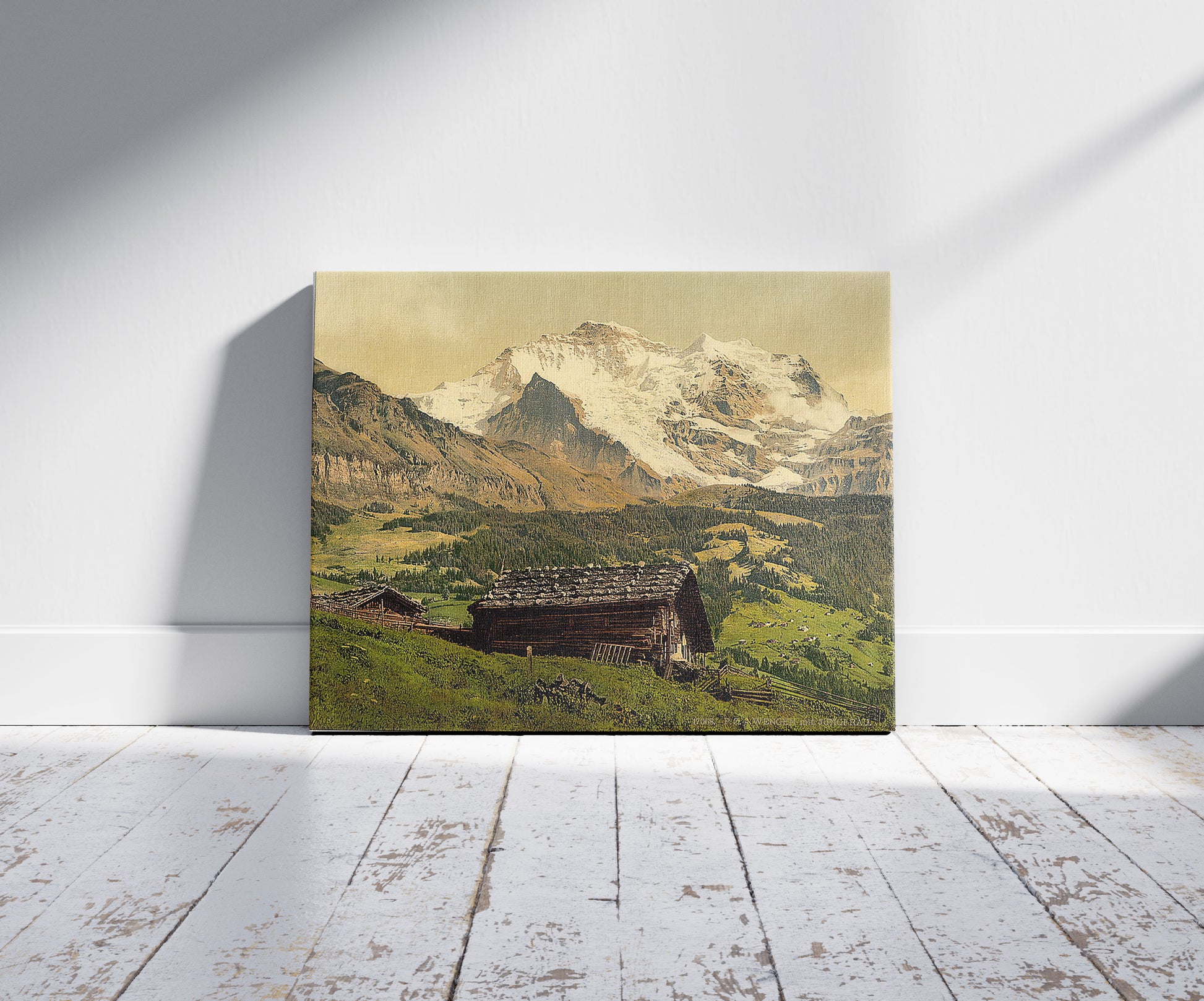 A picture of Wengen and Jungfrau, Bernese Oberland, Switzerland, a mockup of the print leaning against a wall