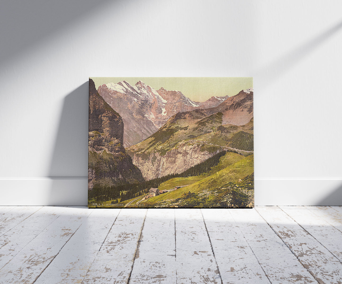 A picture of Wengern Alp and Mittaghorn, Gspaltenhorn and Hotel Jungfrau, Bernese Oberland, Switzerland, a mockup of the print leaning against a wall