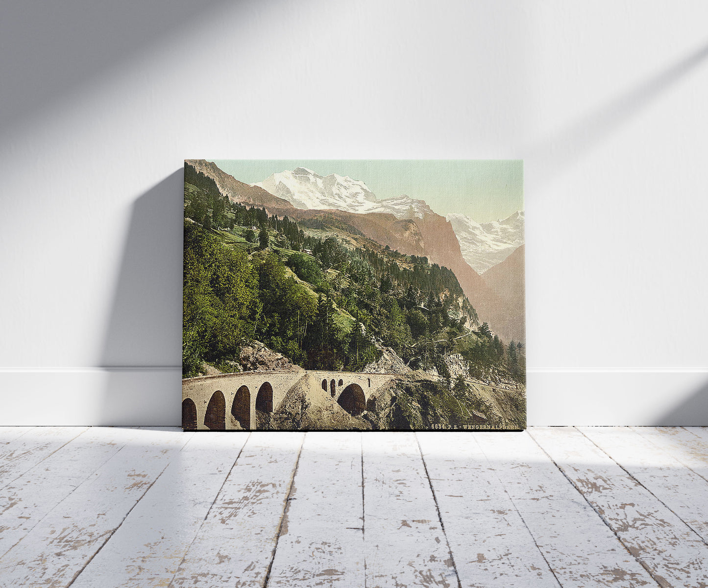 A picture of Wengern Alp Station, railway, Bernese Oberland, Switzerland, a mockup of the print leaning against a wall