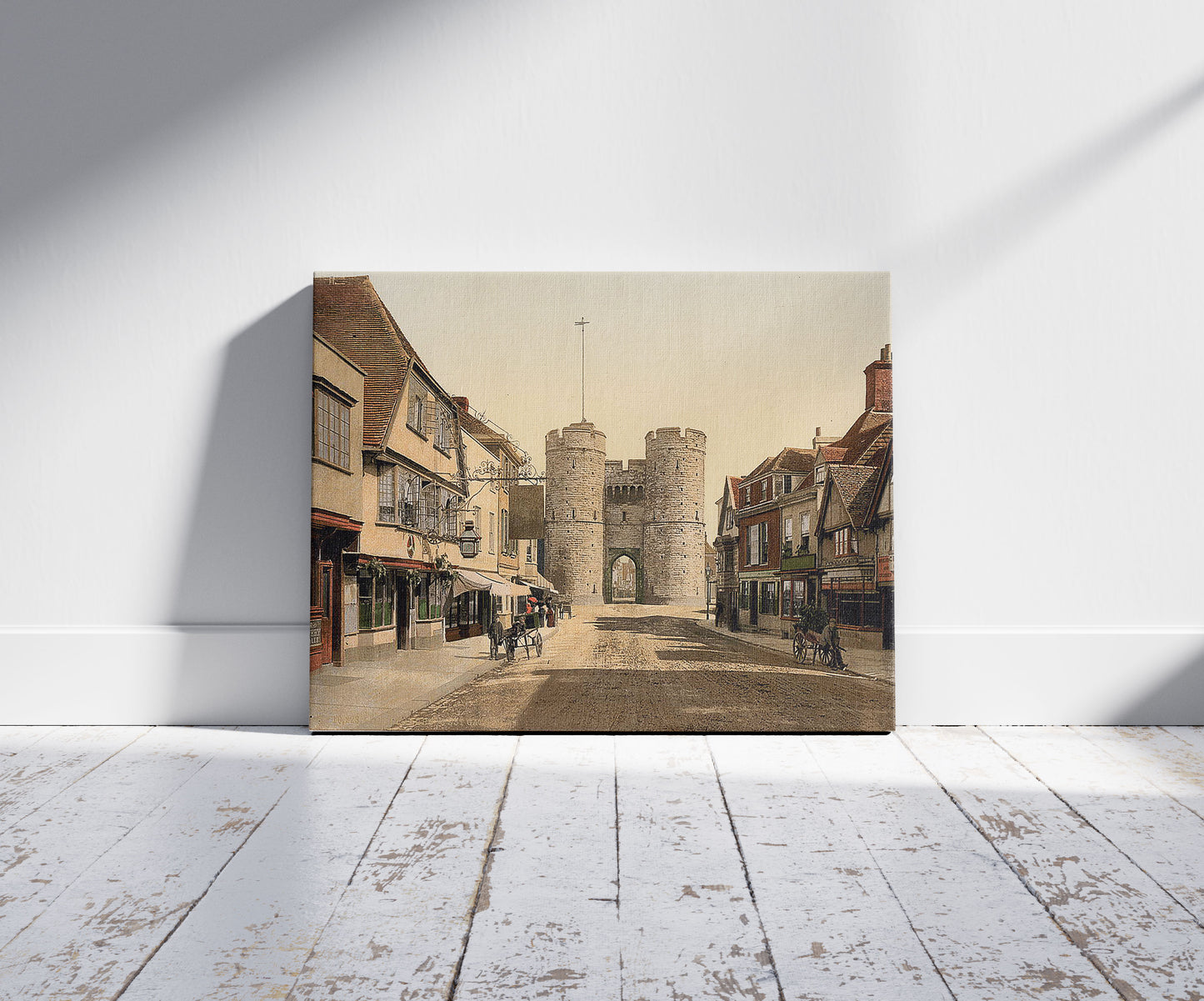 A picture of West Gate, Canterbury, England, a mockup of the print leaning against a wall