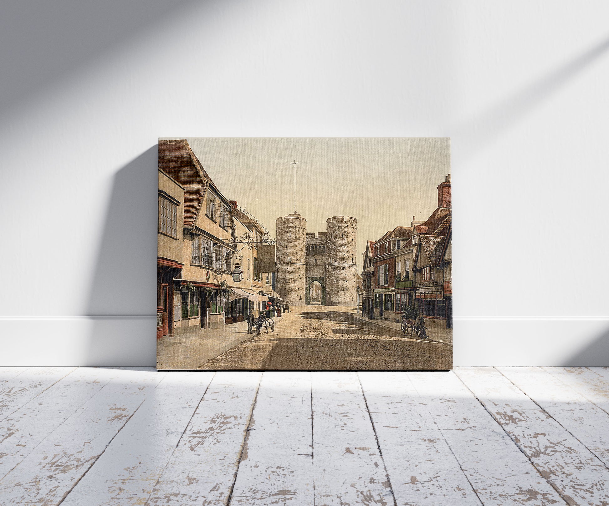 A picture of West Gate, Canterbury, England, a mockup of the print leaning against a wall