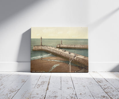 A picture of Whitby, the pier, Yorkshire, England, a mockup of the print leaning against a wall