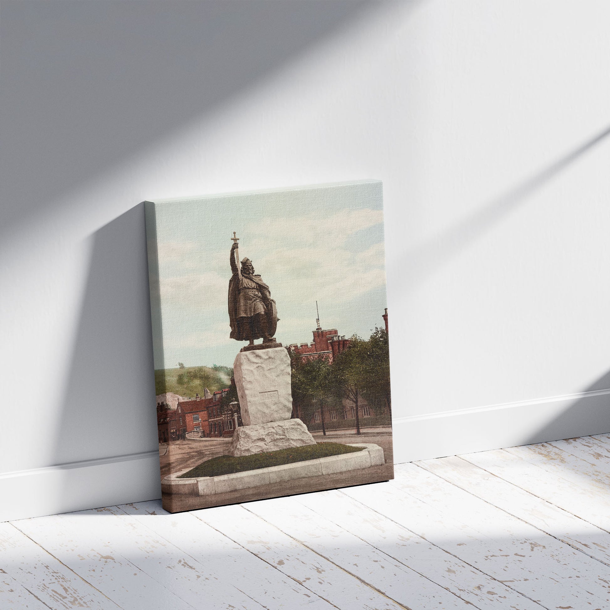 A picture of Winchester. King Alfred's statue, a mockup of the print leaning against a wall