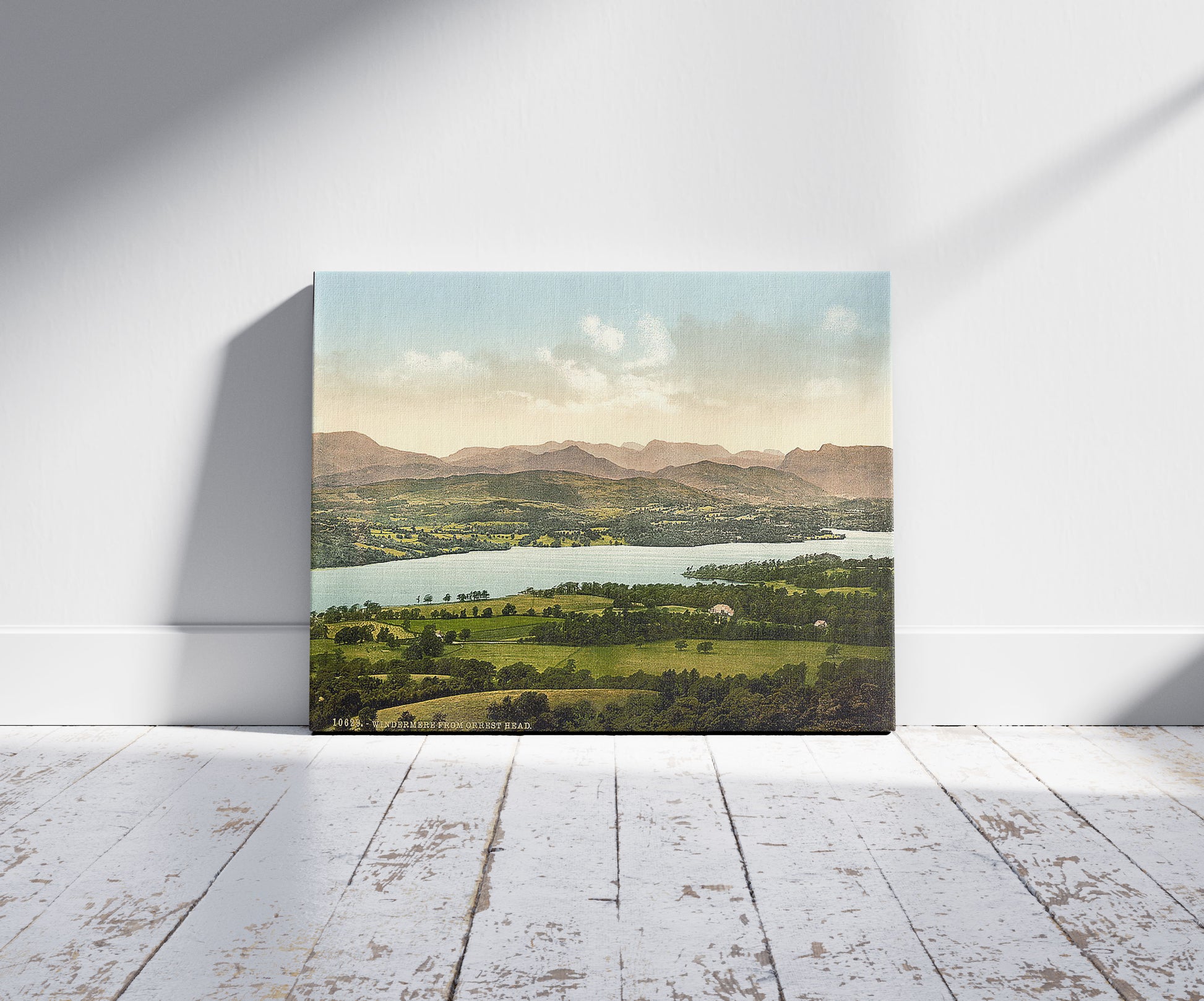 A picture of Windermere, from Orrest Head, Lake District, England, a mockup of the print leaning against a wall