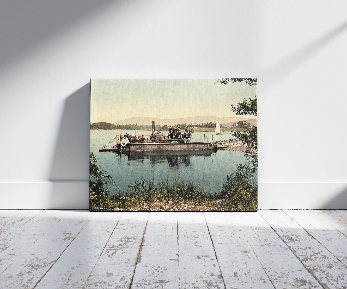 A picture of Windermere, steam ferry, Lake District, England, a mockup of the print leaning against a wall