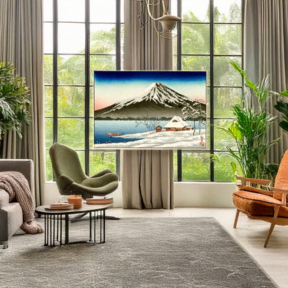 A picture of Winter landscape with small snow-covered building on the coast and view of Mount Fuji, a mockup of the print leaning against a wall