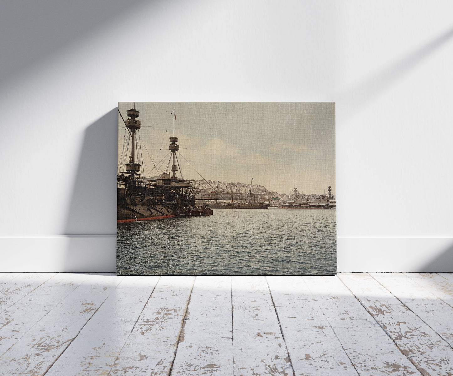 A picture of With war ships, Algiers, Algeria, a mockup of the print leaning against a wall