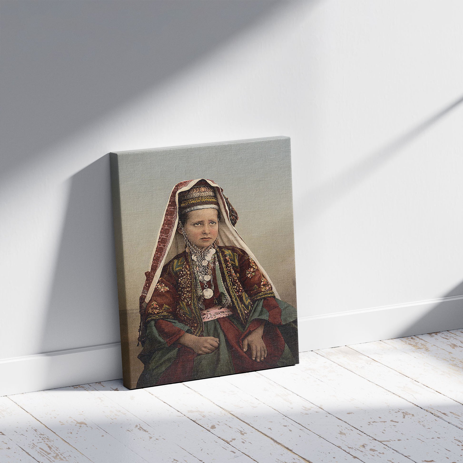 A picture of Young women of Bethlehem in costume, Holy Land, a mockup of the print leaning against a wall
