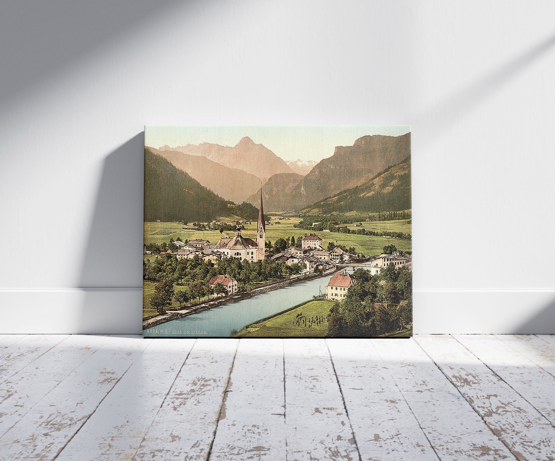 A picture of Zell on the Ziller (i.e., Zell am Ziller), Tyrol, Austro-Hungary, a mockup of the print leaning against a wall