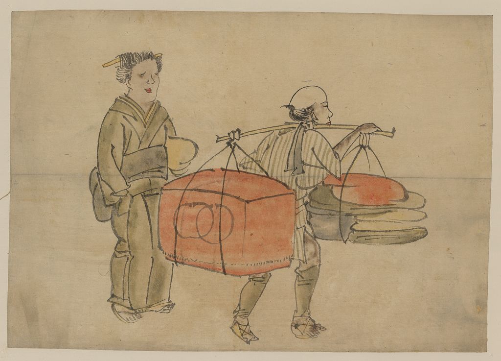 A picture of A man carrying a shoulder pole with a trunk and bedding for a patron standing on the left
