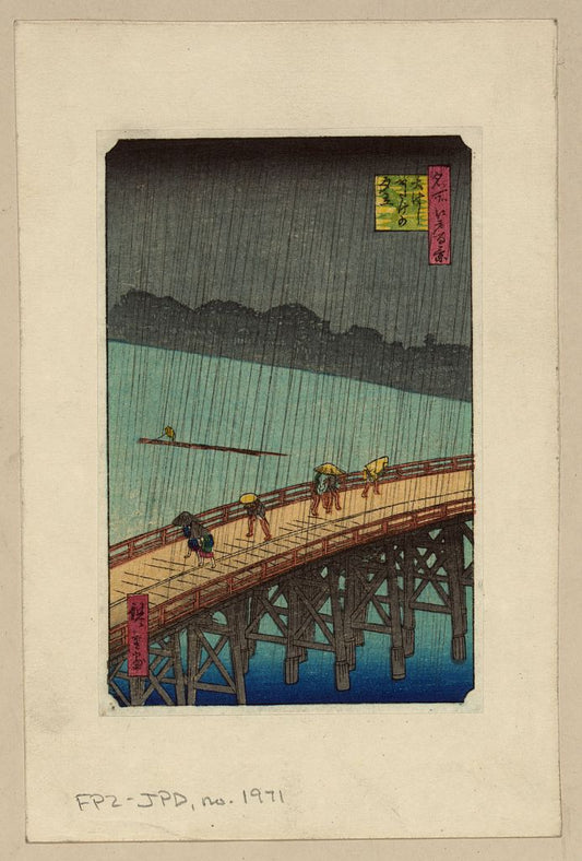 A picture of Pedestrians crossing a bridge during a rain storm