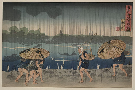 A picture of People walking beneath umbrellas along the seashore during a rainstorm