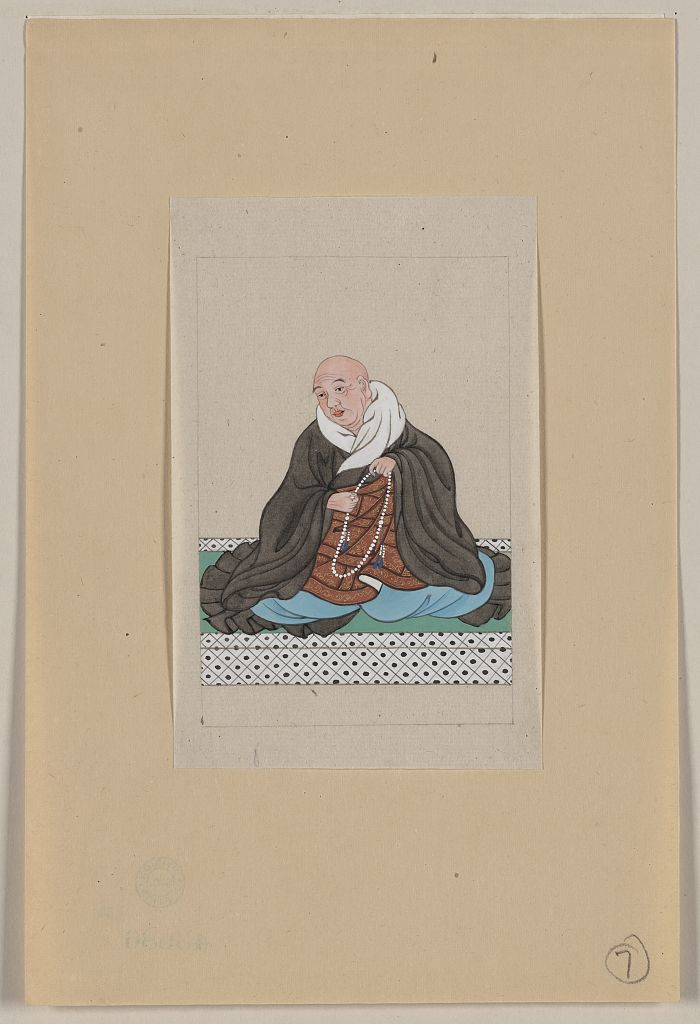 A picture of Religious figure, probably a monk, seated, facing slightly left, holding a loop of prayer beads