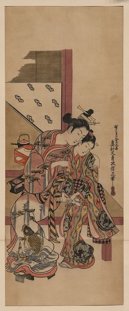 A picture of Two girls whispering