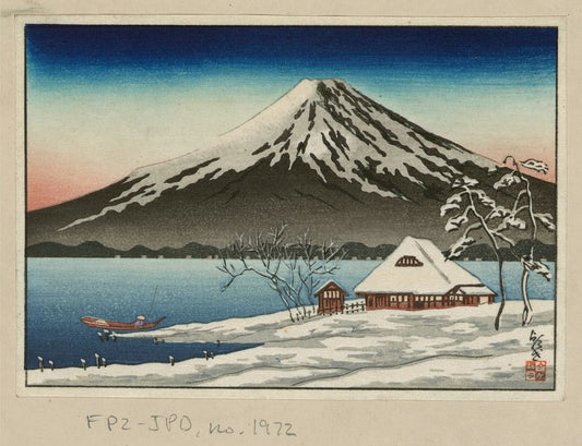 A picture of Winter landscape with small snow-covered building on the coast and view of Mount Fuji